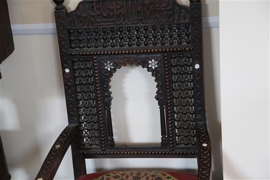 A late 19th century moorish open armchair and a similar armchair